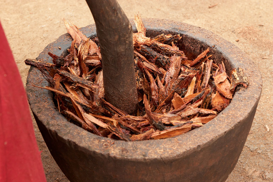 338   Woman crushing bark containing indigo dye